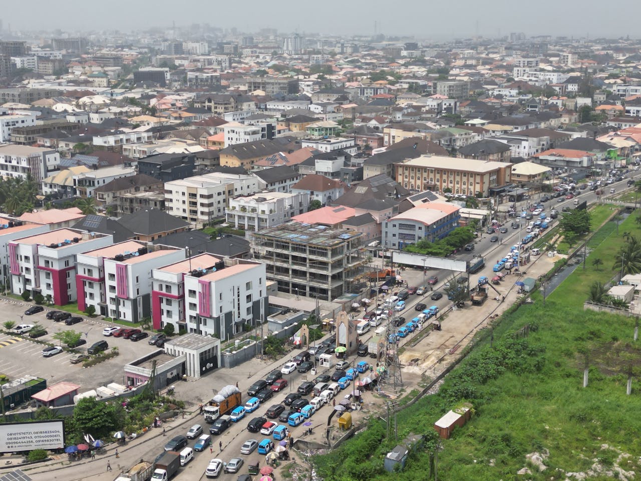 A bustling aerial view of Lagos, Nigeria showcasing dense urban architecture and busy traffic.
